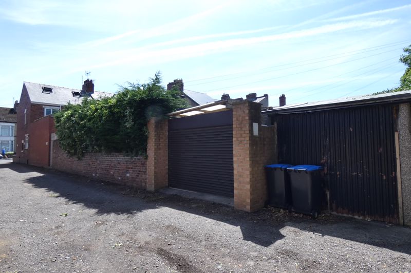 Garage door to off street parking/Drive- click for photo gallery